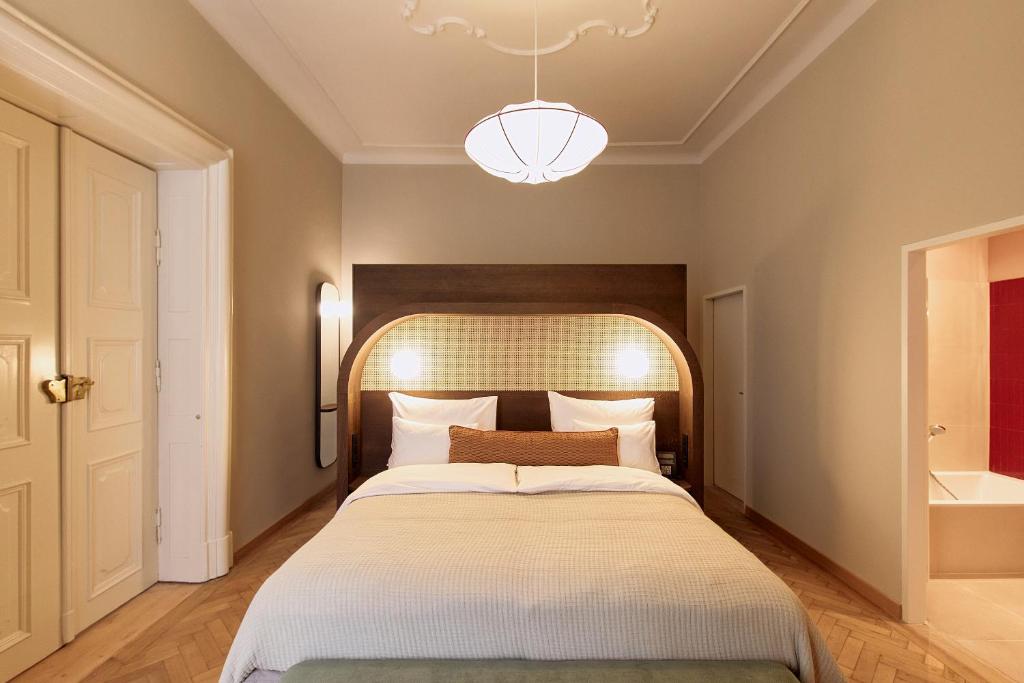 Postel nebo postele na pokoji v ubytování Hotel Palais Mailberger Hof