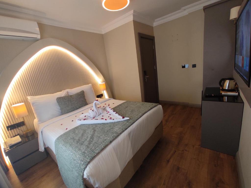 Postel nebo postele na pokoji v ubytování Mara Oldcity