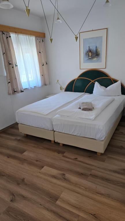 Postel nebo postele na pokoji v ubytování Gasthof Pichler