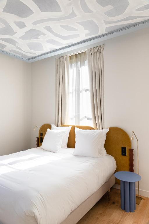 Postel nebo postele na pokoji v ubytování Hotel Saint Julien