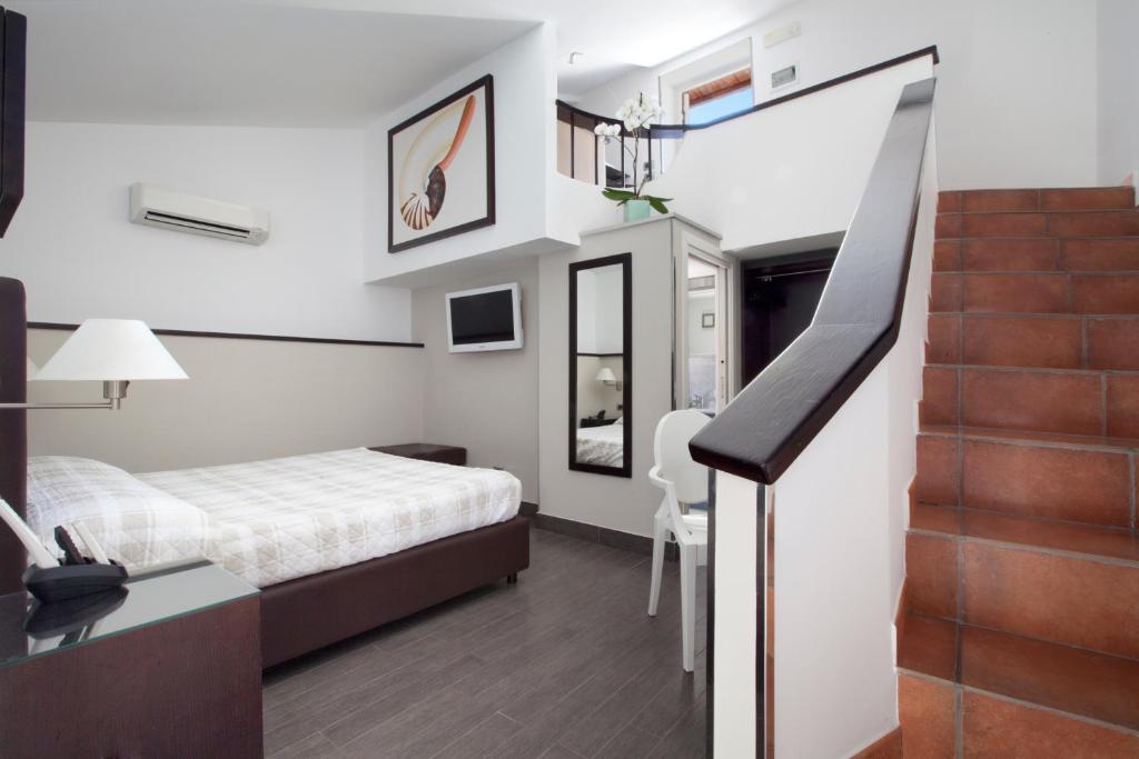 A bed or beds in a room at Magi House Relais