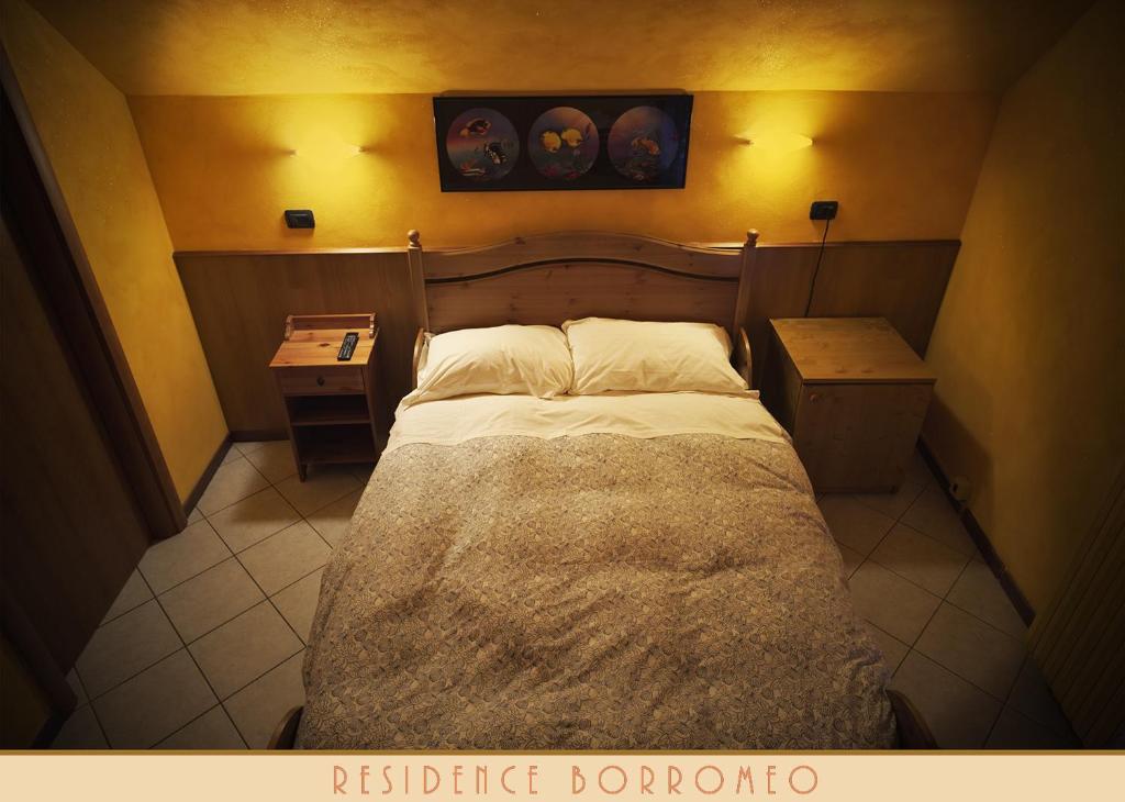 Postel nebo postele na pokoji v ubytování Borromeo Residenze Service s.a.s