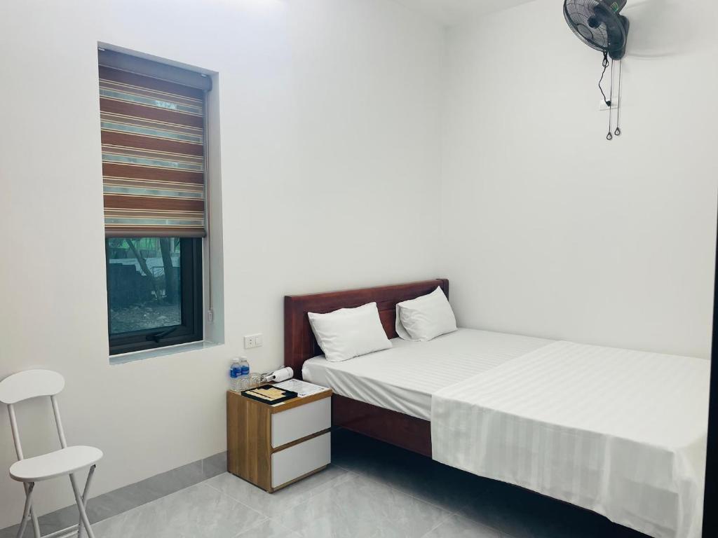 Postel nebo postele na pokoji v ubytování Hoàng Anh Hotel