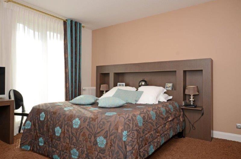 Postel nebo postele na pokoji v ubytování Hôtel La Réserve