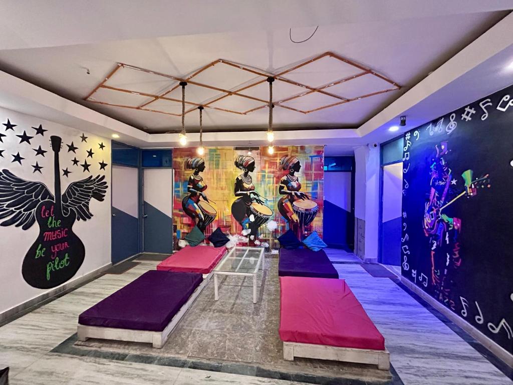 a yoga room with colorful mats on the walls at ZoukStayz in Rishīkesh