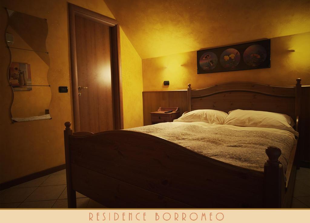 Postel nebo postele na pokoji v ubytování Borromeo Residenze Service s.a.s