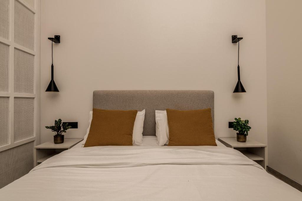 Posteľ alebo postele v izbe v ubytovaní New Beach Hotel