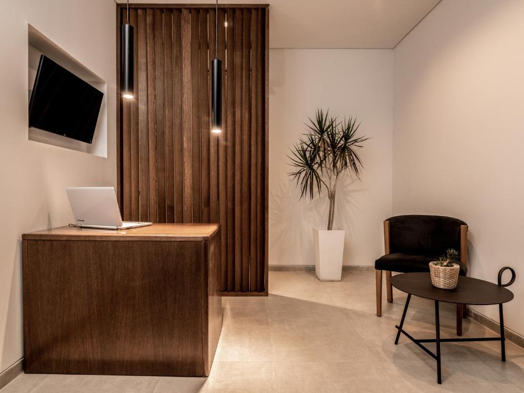 Televízia a/alebo spoločenská miestnosť v ubytovaní New Beach Hotel