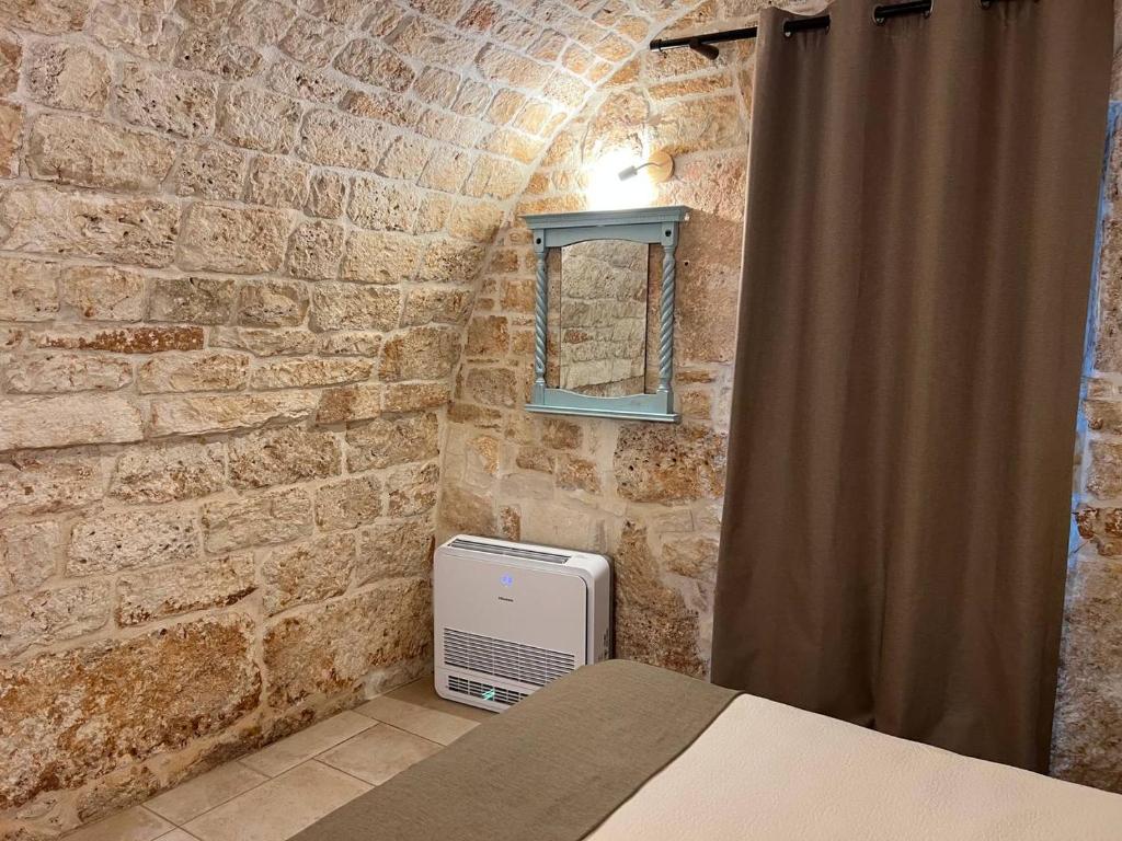 A bed or beds in a room at MILESTONES FAMILY SUITE - Rione Monti
