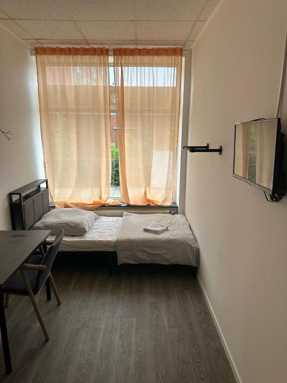 Postel nebo postele na pokoji v ubytování HH Hostels