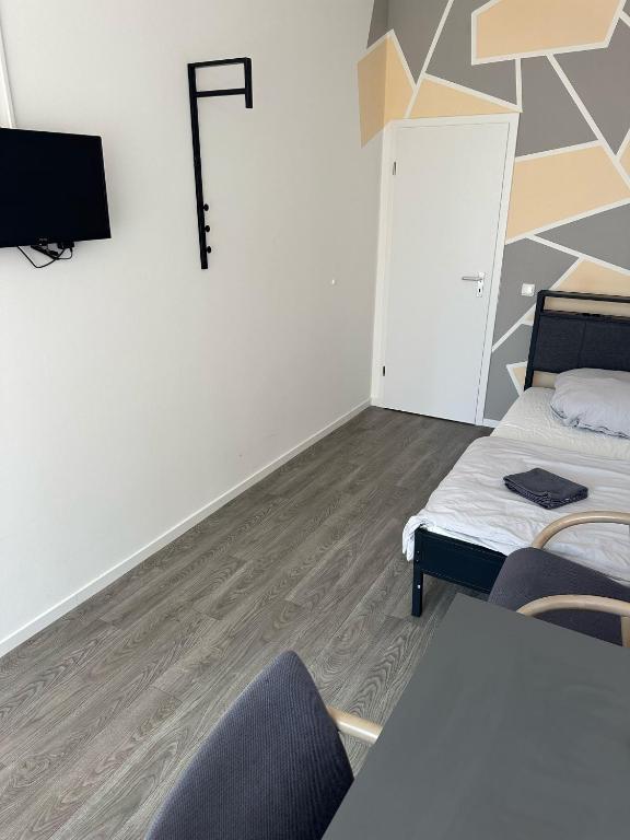 Postel nebo postele na pokoji v ubytování HH Hostels