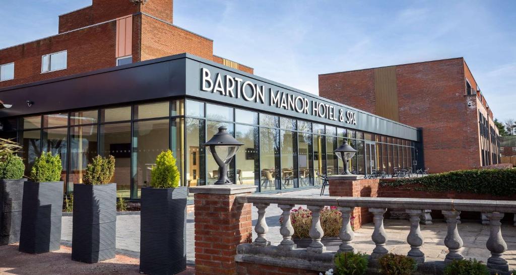 a building with a sign on the front of it at Barton Manor Hotel & Spa, BW Signature Collection in Preston