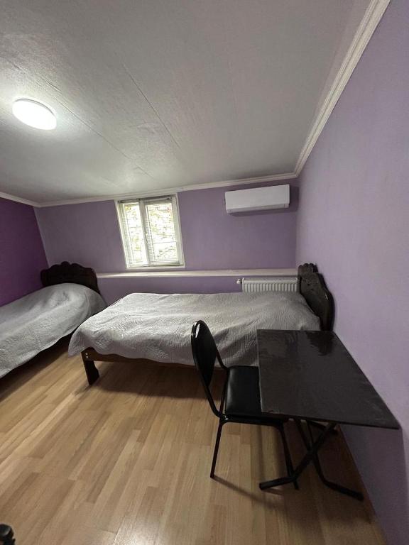 Postel nebo postele na pokoji v ubytování gogoli family hotel