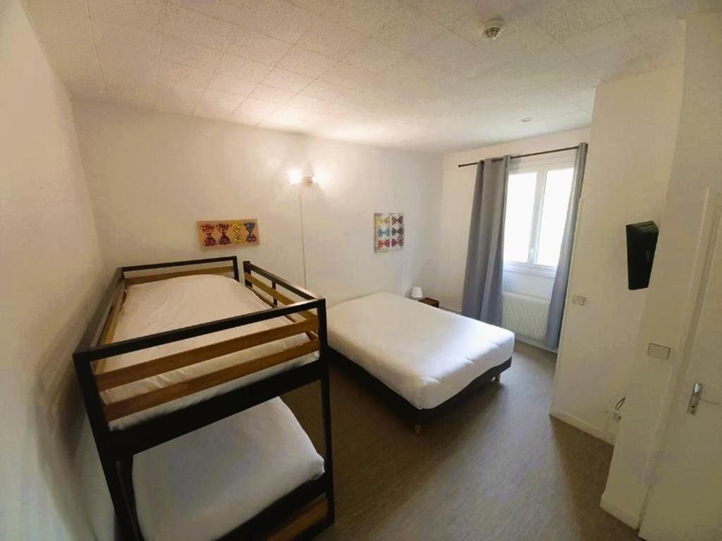 Postel nebo postele na pokoji v ubytování Hôtel Restaurant AKENA Camiers-Le Touquet - 2 étoiles