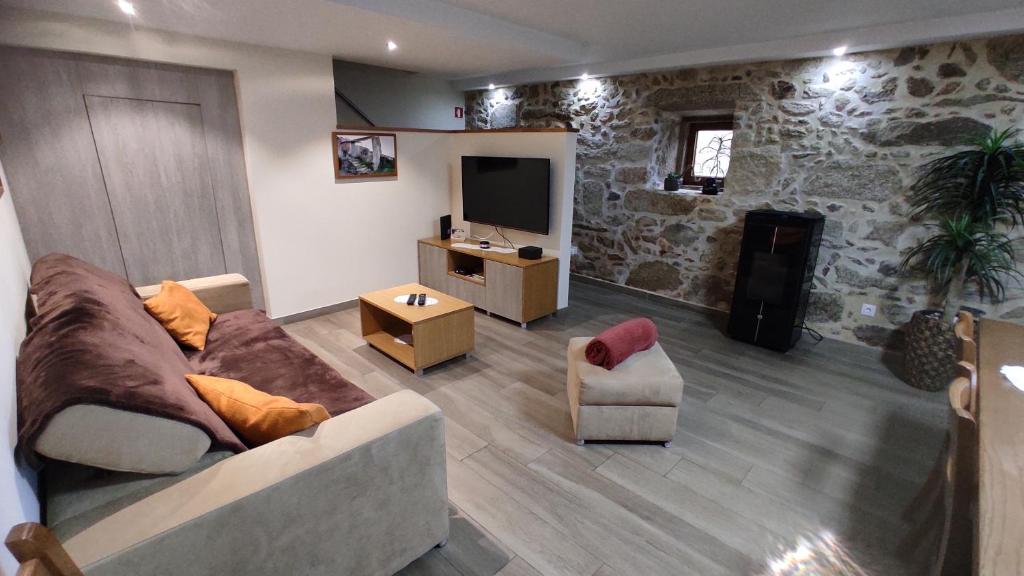TV a/nebo společenská místnost v ubytování Casa do Caminho - Ossela