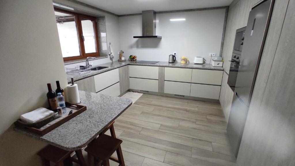 Kuchyň nebo kuchyňský kout v ubytování Casa do Caminho - Ossela