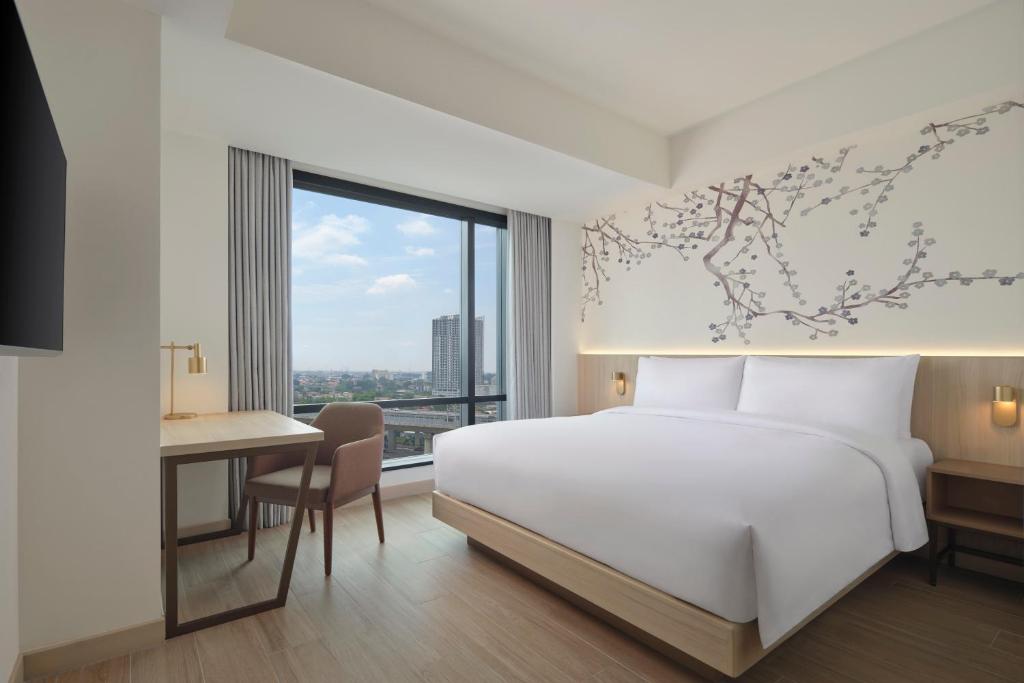 Postel nebo postele na pokoji v ubytování Fairfield by Marriott Bekasi