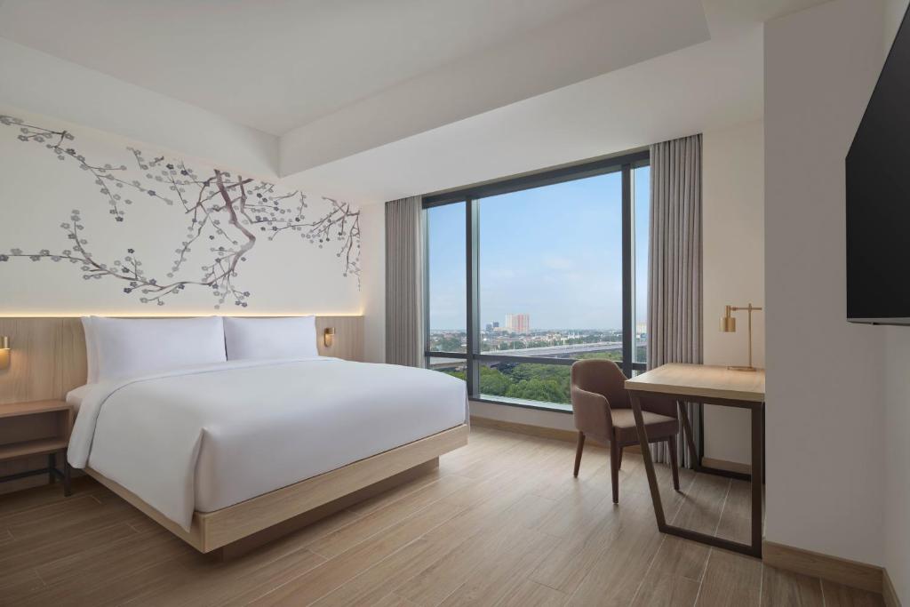 Postel nebo postele na pokoji v ubytování Fairfield by Marriott Bekasi