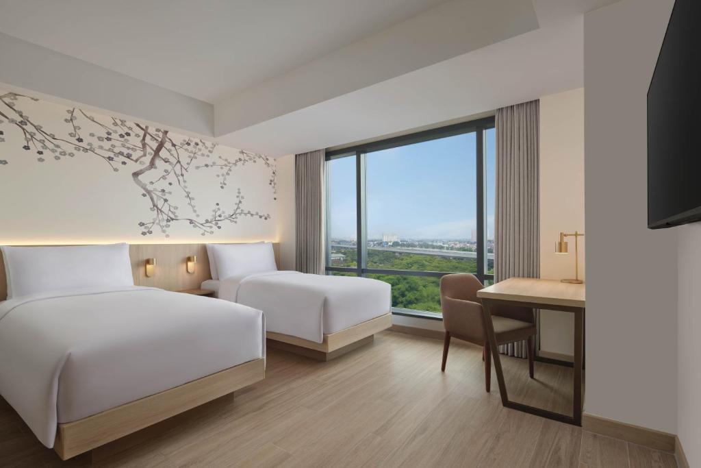 Postel nebo postele na pokoji v ubytování Fairfield by Marriott Bekasi