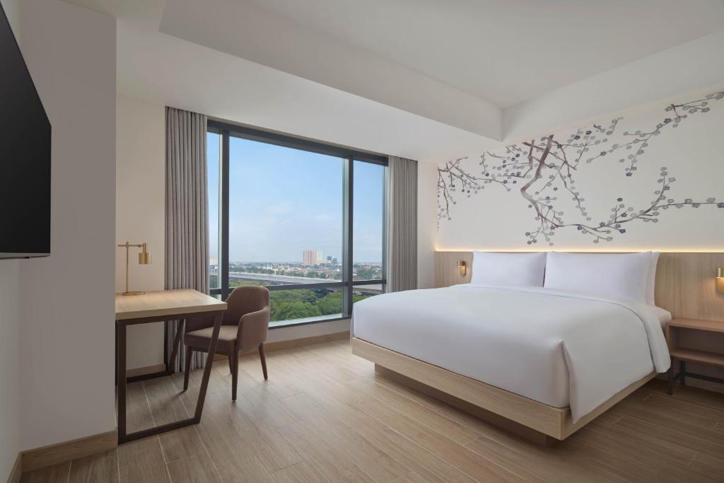 Postel nebo postele na pokoji v ubytování Fairfield by Marriott Bekasi