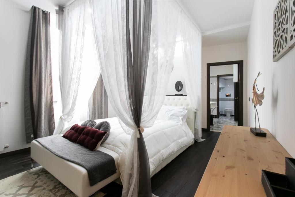 Postel nebo postele na pokoji v ubytování Aparthotel Dei Mercanti
