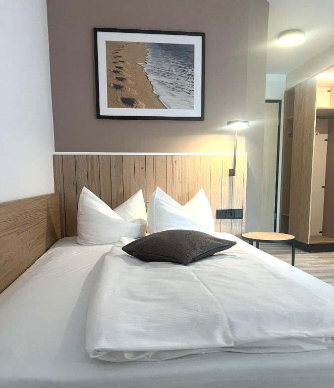 Postel nebo postele na pokoji v ubytování Atrium Hotel Krüger