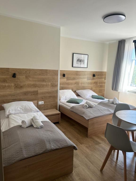 Posteľ alebo postele v izbe v ubytovaní Apartament, Pokoje Koniczynka