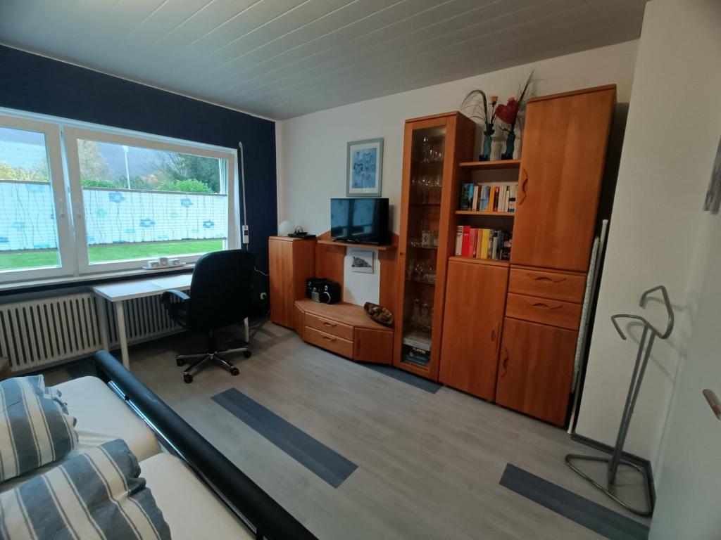 TV a/nebo společenská místnost v ubytování Ferienwohnung Dahlbruch