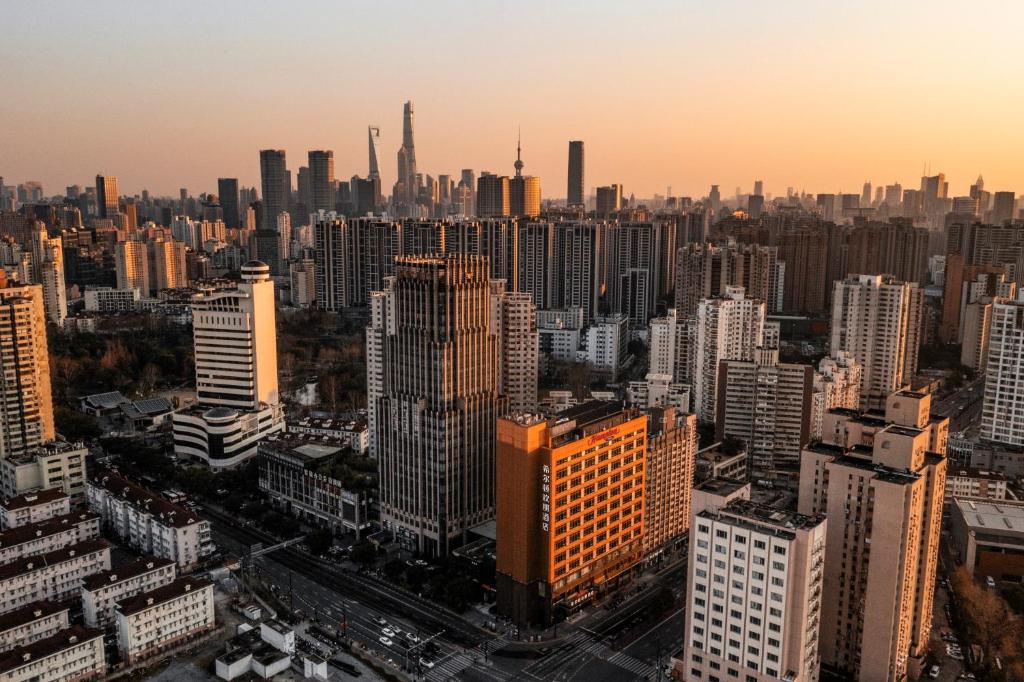 an aerial view of a large city with skyscrapers at Hampton by Hilton Shanghai North Bund Siping Road in Shanghai