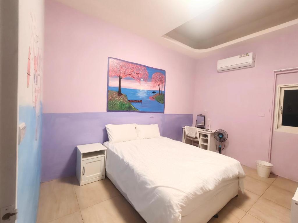 Postel nebo postele na pokoji v ubytování Xinyuanbao Shangshi Homestay