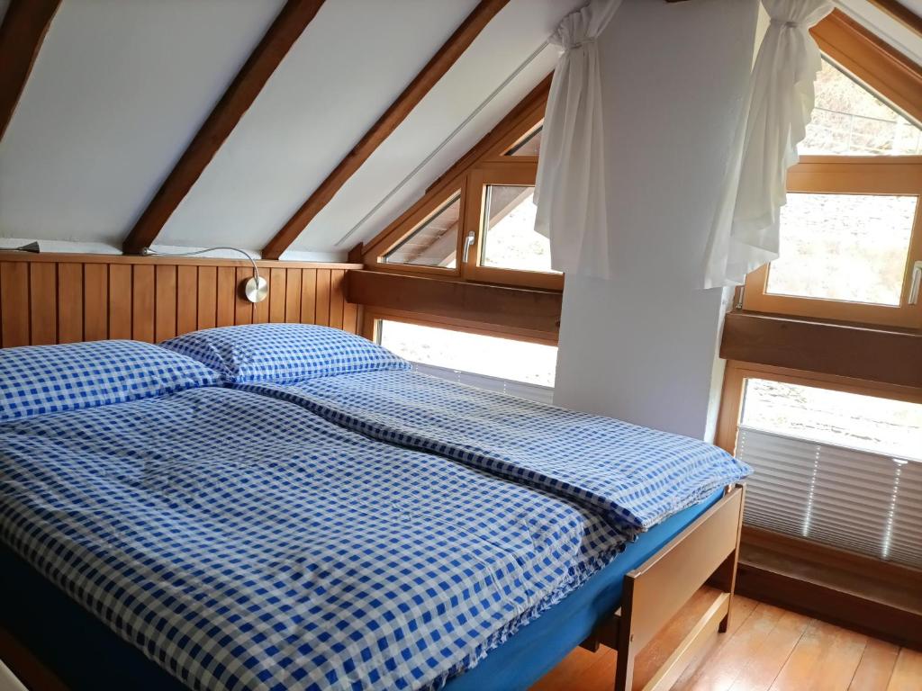 Postel nebo postele na pokoji v ubytování Rustico "Casa di Sasso"