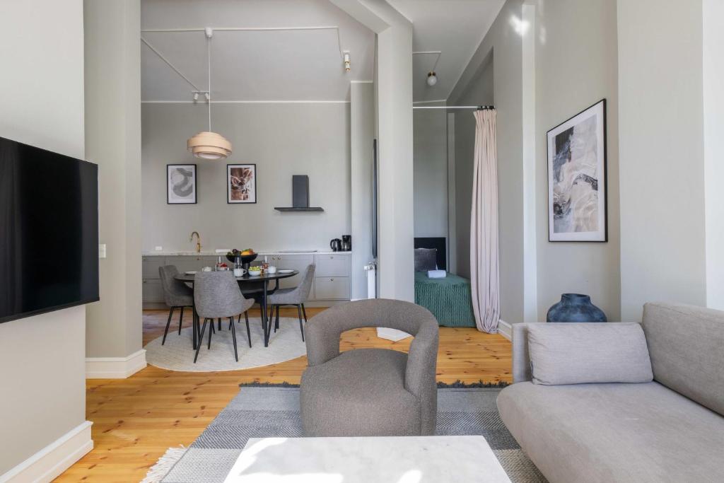 a living room with a couch and a table at Centrally Located 3 Bedroom Apartment in Copenhagen