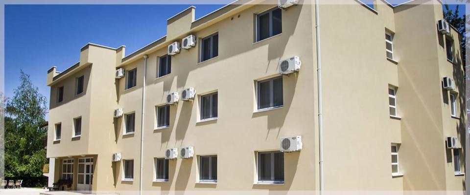 a building with air conditioners on the side of it at Domus Damar in Međugorje