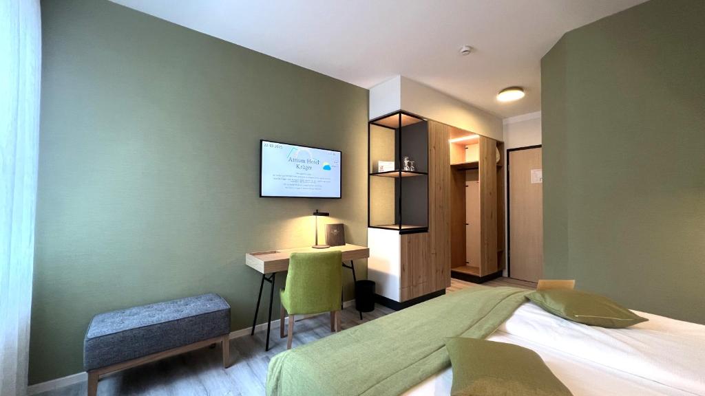 Postel nebo postele na pokoji v ubytování Atrium Hotel Krüger