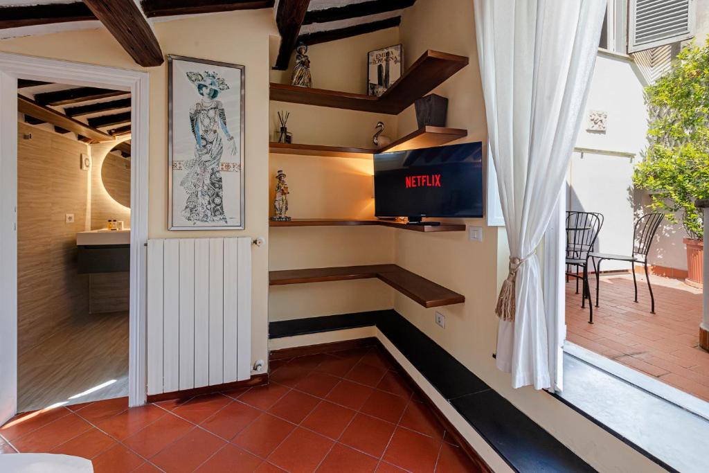 Televízia a/alebo spoločenská miestnosť v ubytovaní Luxury Apartment Pantheon