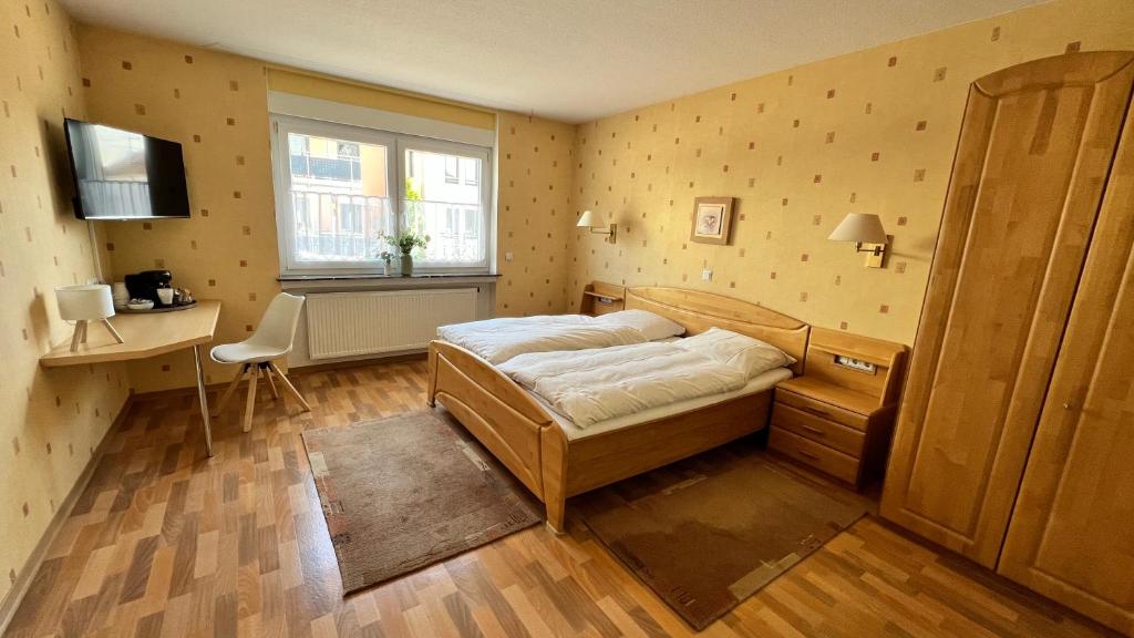 Postel nebo postele na pokoji v ubytování Gästehaus Kliebenstein