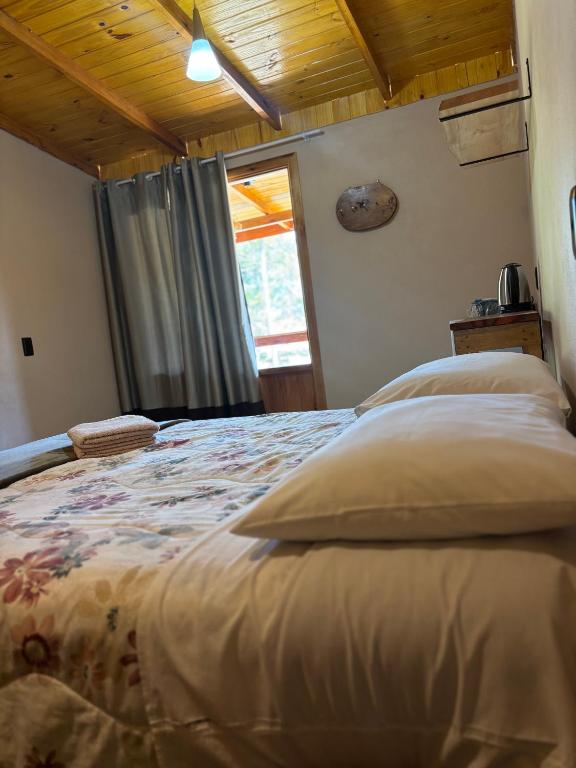 Postel nebo postele na pokoji v ubytování Hospedagem Brilho do Entardecer