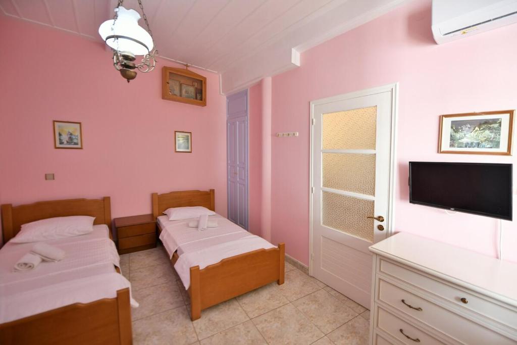 Postel nebo postele na pokoji v ubytování Astraea 7