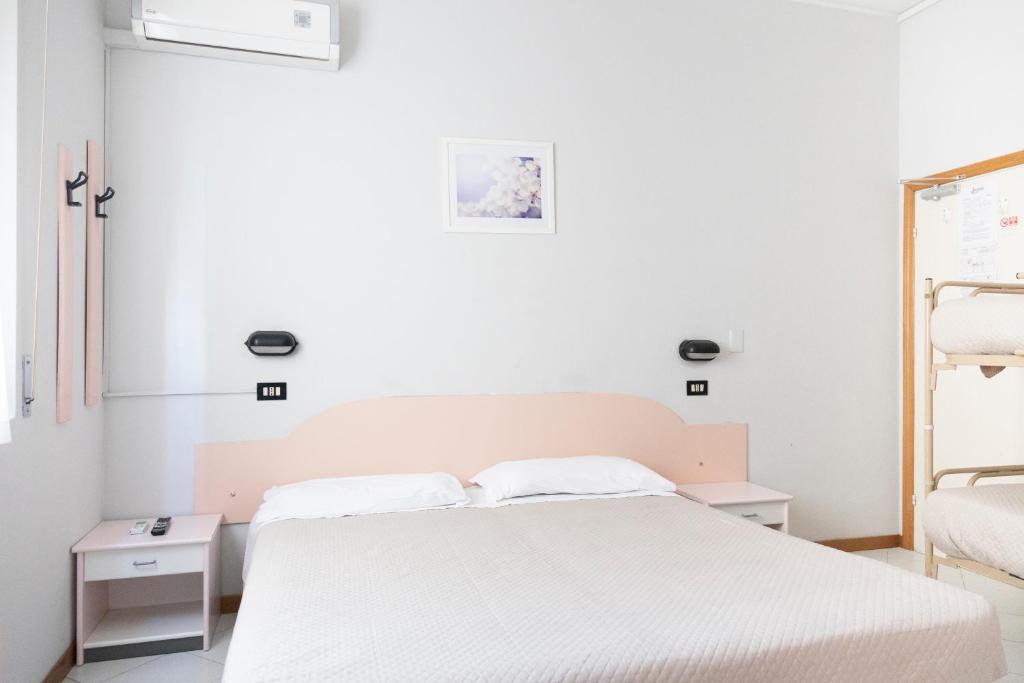 Postel nebo postele na pokoji v ubytování Hotel Laura Beach