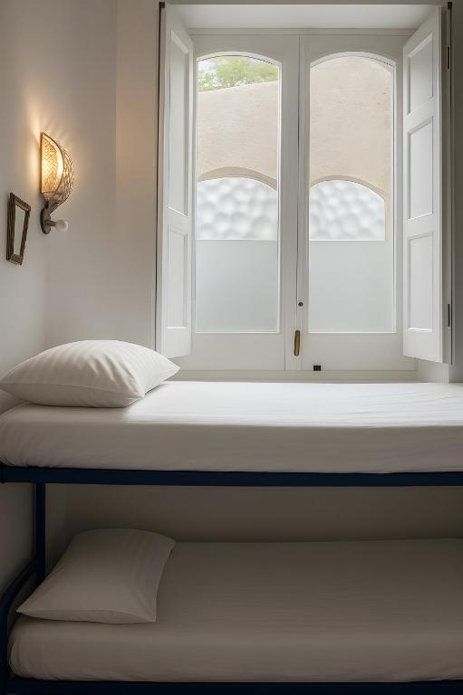 Postel nebo postele na pokoji v ubytování Hostel Brikette