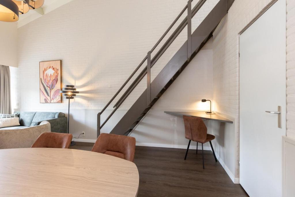 Een zitgedeelte bij Aparthotel Delden