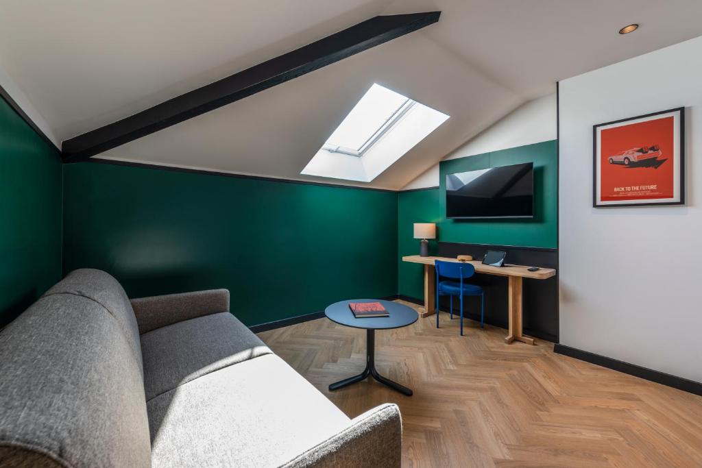 TV a/nebo společenská místnost v ubytování Hotel Le Lumière