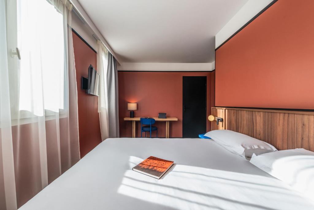 Postel nebo postele na pokoji v ubytování Hotel Le Lumière