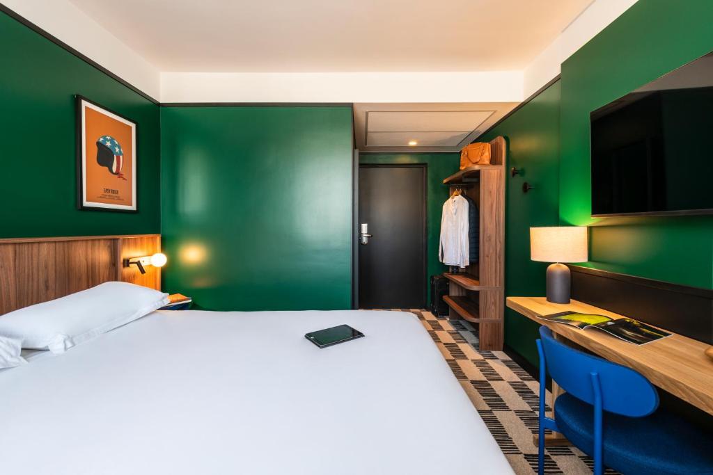 Postel nebo postele na pokoji v ubytování Hotel Le Lumière