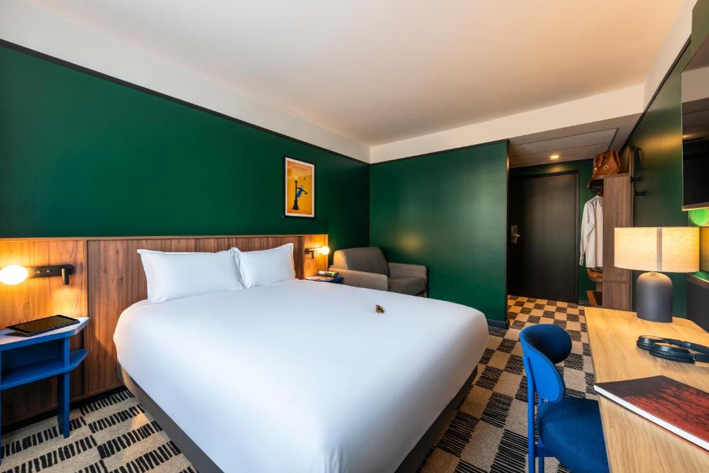Postel nebo postele na pokoji v ubytování Hotel Le Lumière