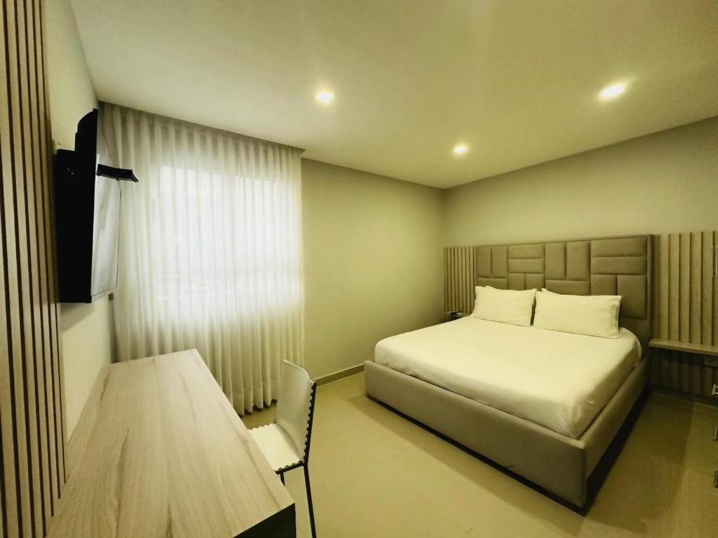 Postel nebo postele na pokoji v ubytování Hotel OR Suite