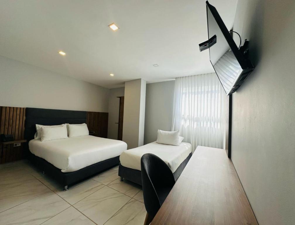 Postel nebo postele na pokoji v ubytování Hotel OR Suite