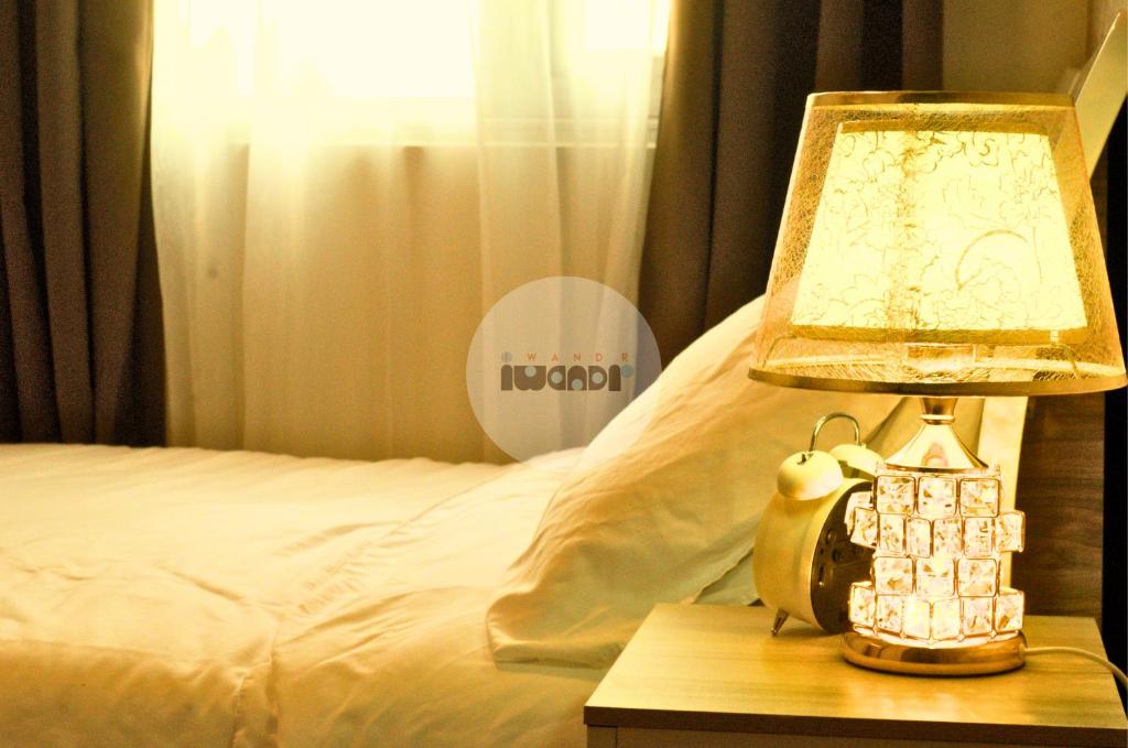 Katil atau katil-katil dalam bilik di iWandr Suites at SMDC Charm Residences