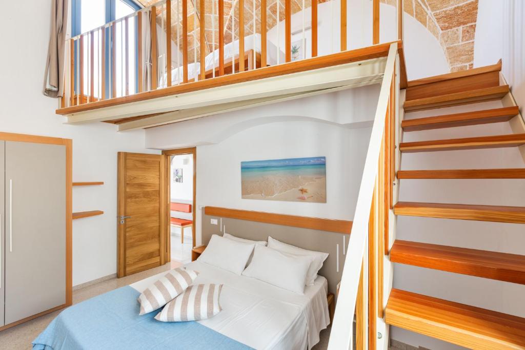 Postel nebo postele na pokoji v ubytování La Corte Relais