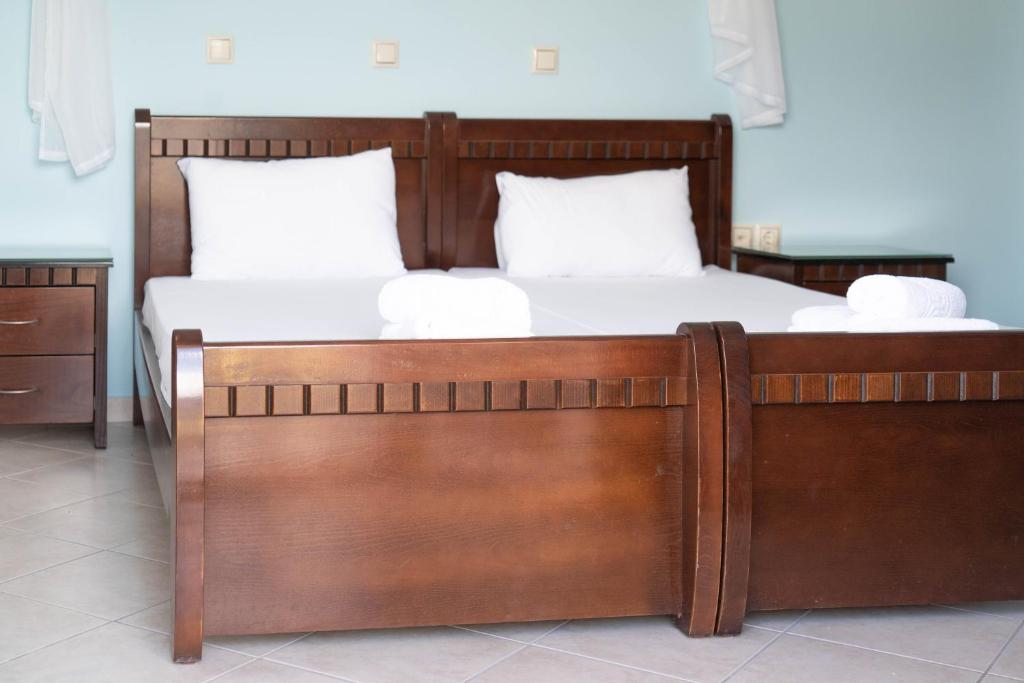 Postel nebo postele na pokoji v ubytování Hotel Alexandros